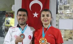 Evli çift madalyalarla döndüler