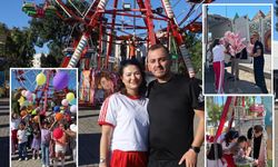 Sivaslı genç çift çocuk özlemini lunaparkta yaşattılar